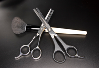 Hair cutting scissors and makeup brush
