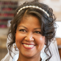 Smiling bride after having her hair and makeup done for her wedding