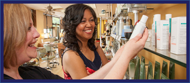 woman holding a product body while talking to a client